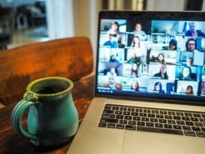 macbook pro displaying a group meeting